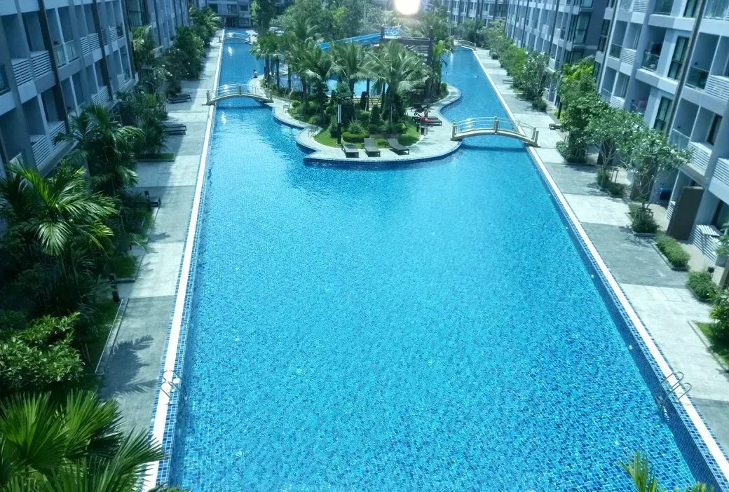 Dusit Grand Park — lagoon pool with footbridges